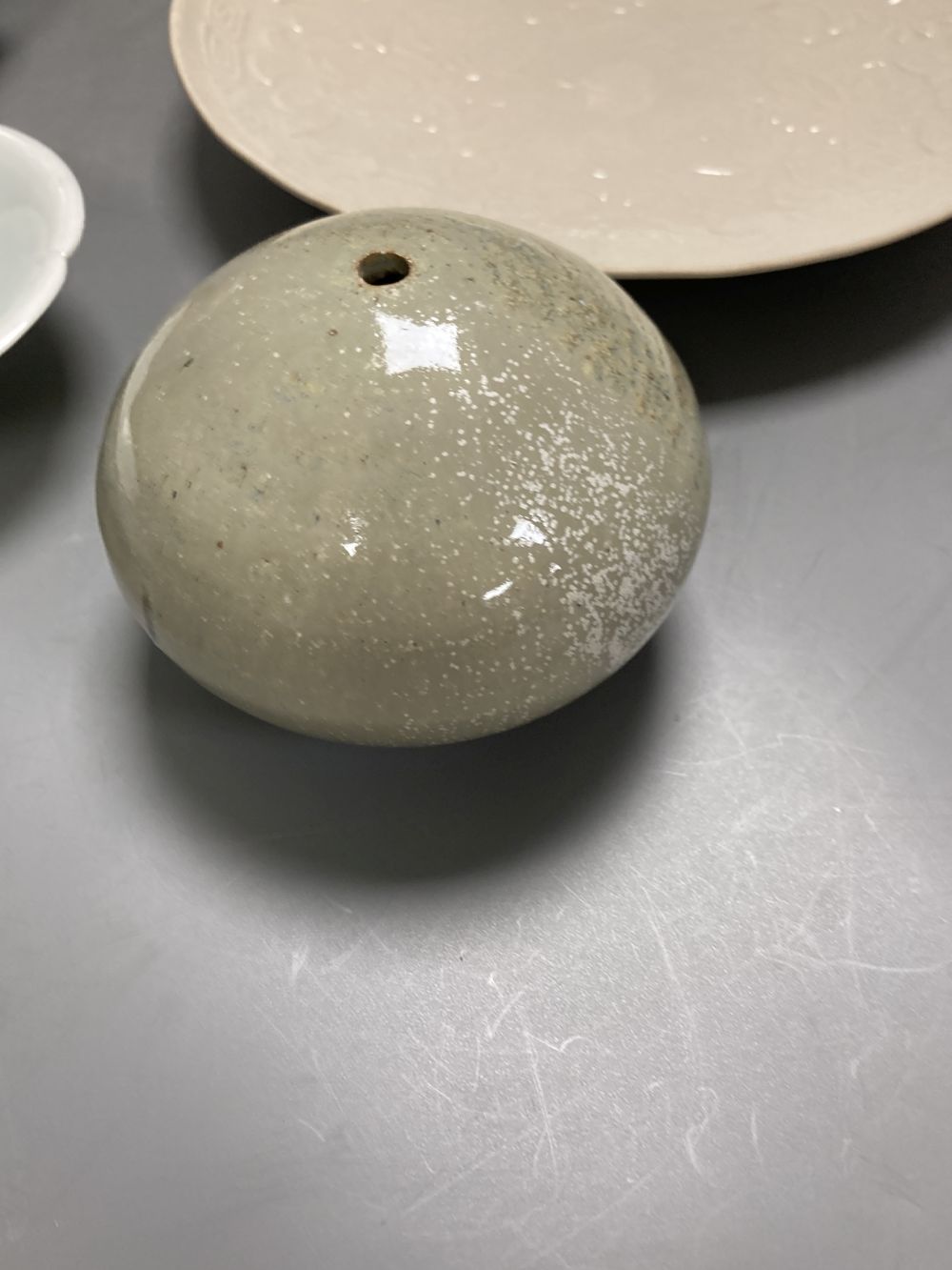 A Chinese Ding type dish, 21.5cm a similar lobed jarlet, possibly Yuan, a Qingbai style dish and another jar,